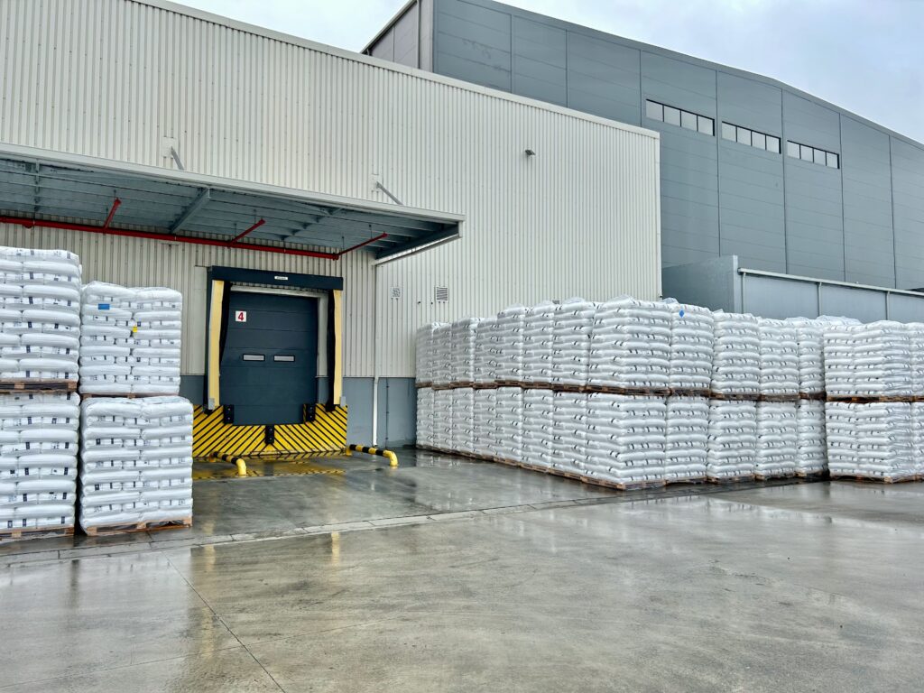 Large loading bay area with stock lying around